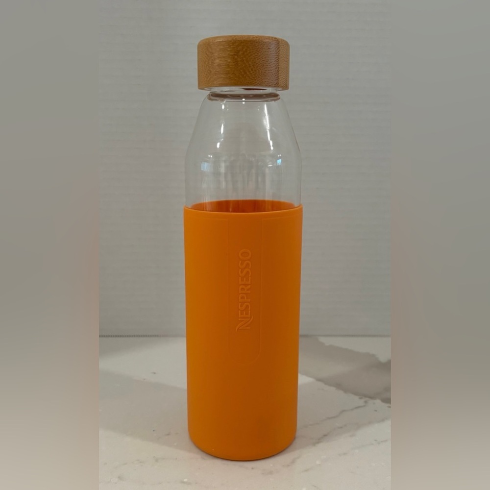 Nespresso Limited Edition Clear Glass Bottle, Orange Silicone Sleeve, Bamboo Lid